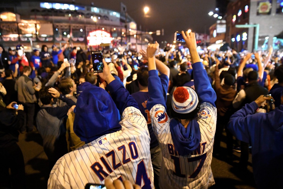 Chicago Cubs fans celebrate after game seven of the 2016 World Series against the Cleveland Indians outside of Wrigley Field. Cubs won 8-7.